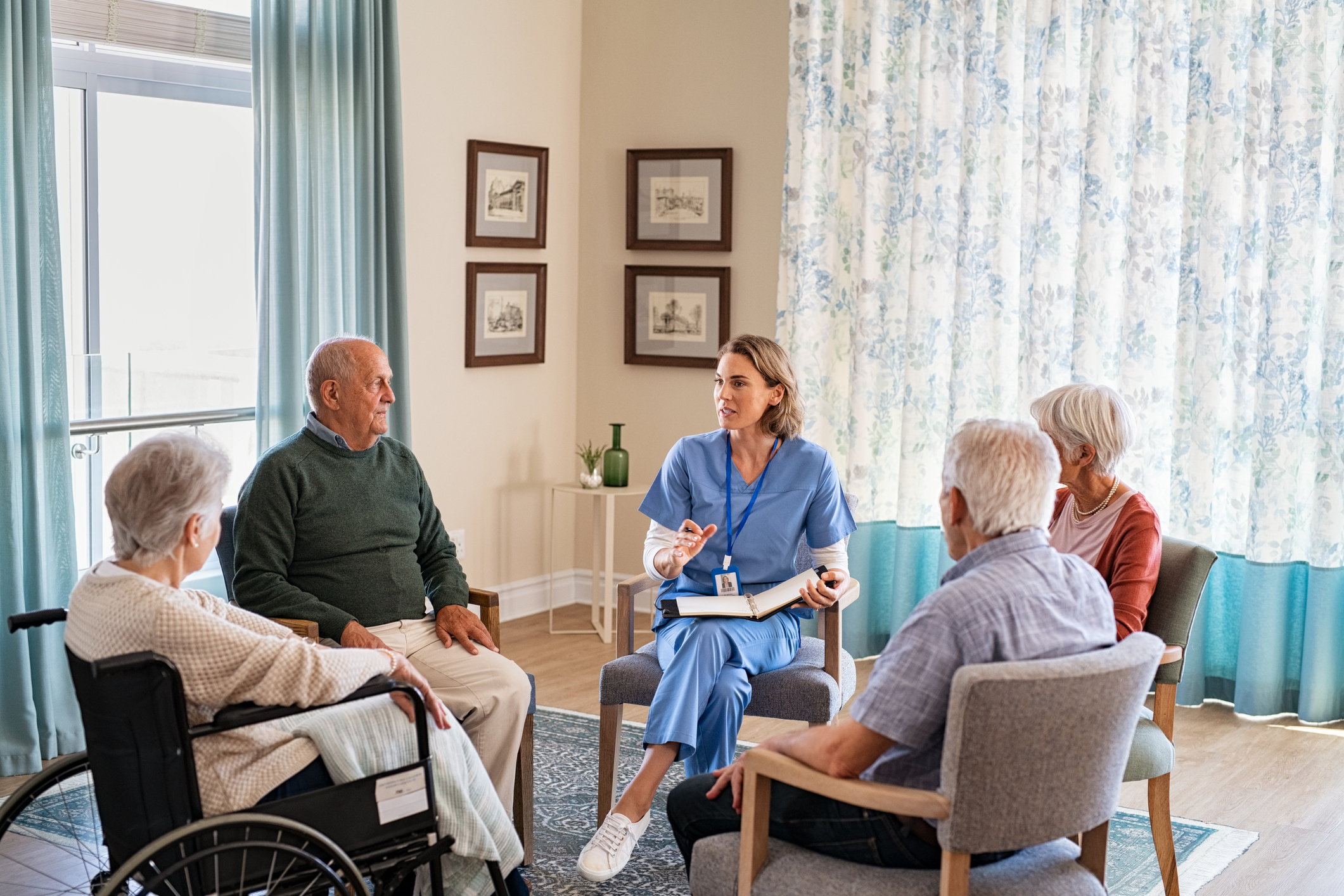 Nurse Talking To Senior People During Group Therapy Lancaster Cancer nurse-talking-to-senior-people-during-group-therapy-lancaster-cancer